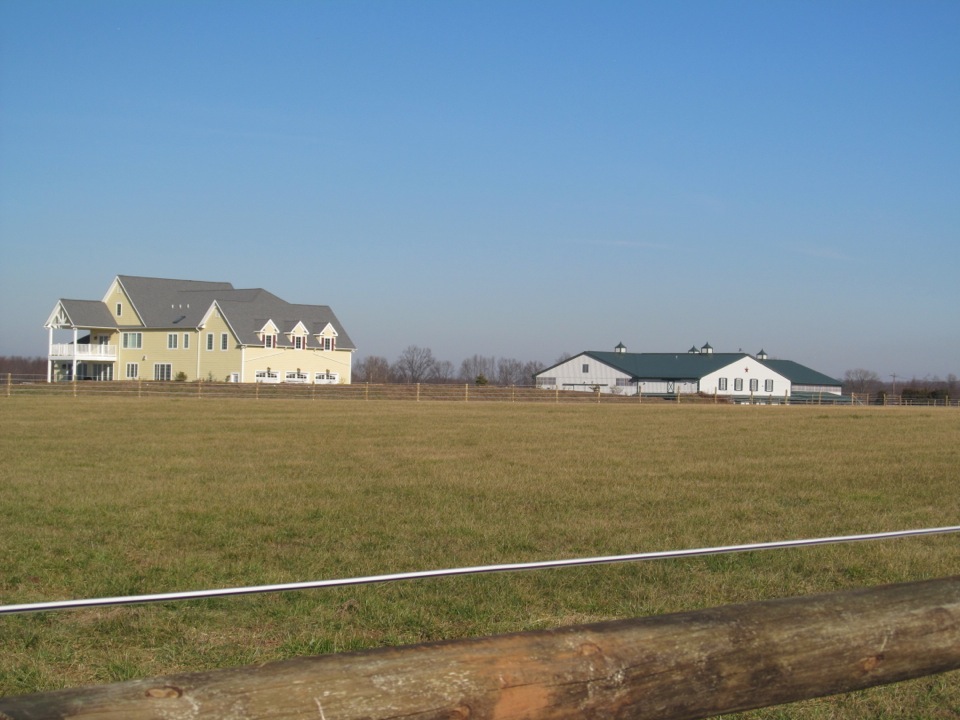 House and barn with fence