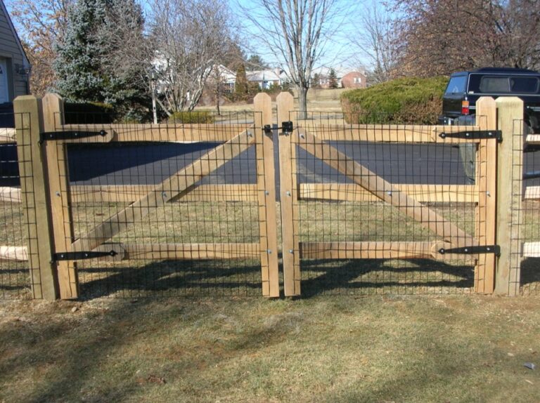 Wooden gate with overlaid mesh wire