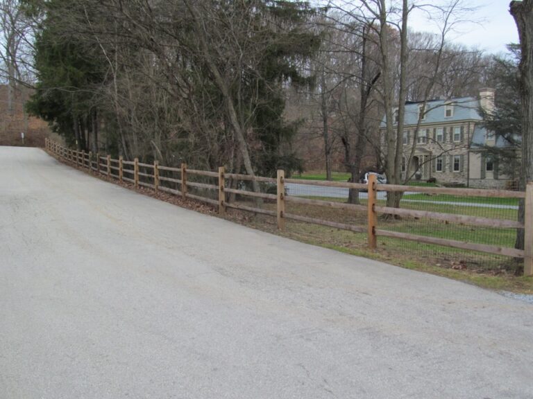 Rail fence along road
