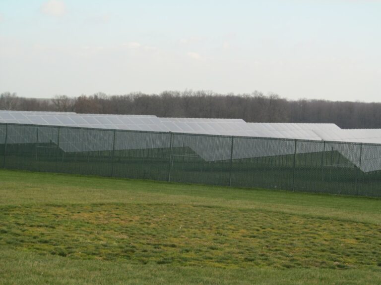 Panels surrounded by chain fence