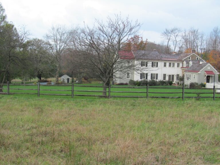 Rail Fence with Large House in background