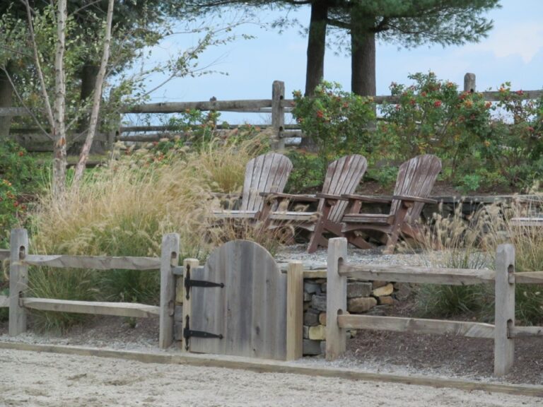 Chairs behind rail fence